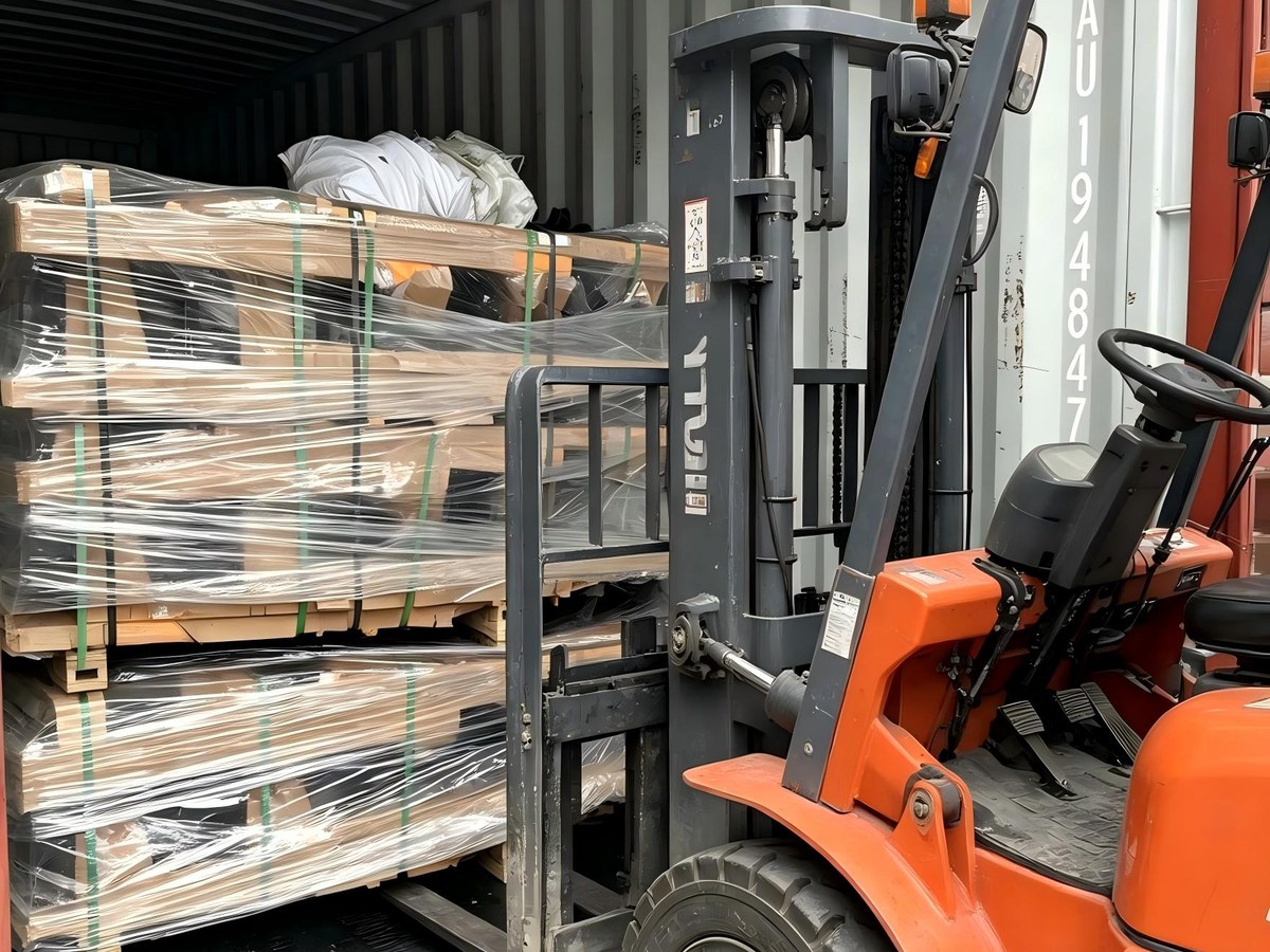 Forklift loading a container